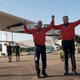 Pilots Bertrand Piccard, left and Andre Borschberg, right, celebrate the landing of the solar-powered plane at San Pablo airport in Seville, Spain on Thursday, June 23, 2016. An experimental solar-powered airplane Thursday completed an unprecedented three-day flight across the Atlantic in the latest leg of its globe-circling voyage. (AP Photo/Laura Leon)
